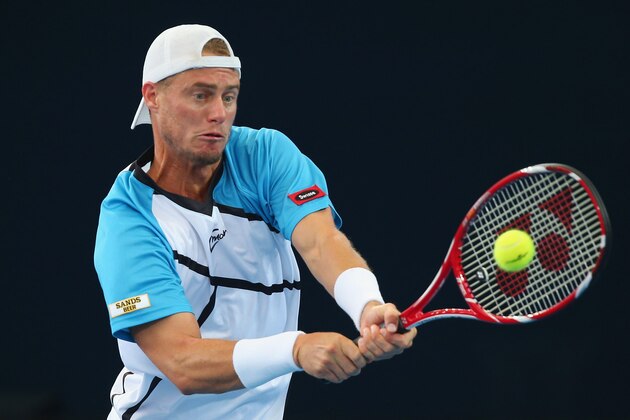 BRISBANE, AUSTRALIA - JANUARY 05:   Lleyton Hewitt of Australia plays a backhand in his mens final match against Roger Federer of Switzerland during day eight of the 2014 Brisbane International at Queensland Tennis Centre on January 5, 2014 in Brisbane, Australia.  (Photo by Chris Hyde/Getty Images)