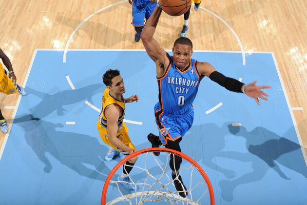 DENVER, CO - DECEMBER 17: Russell Westbrook #0 of the Oklahoma City Thunder dunks against the Denver Nuggets on December 17, 2013 at the Pepsi Center in Denver, Colorado. NOTE TO USER: User expressly acknowledges and agrees that, by downloading and/or using this Photograph, user is consenting to the terms and conditions of the Getty Images License Agreement. Mandatory Copyright Notice: Copyright 2013 NBAE (Photo by Garrett W. Ellwood/NBAE via Getty Images)