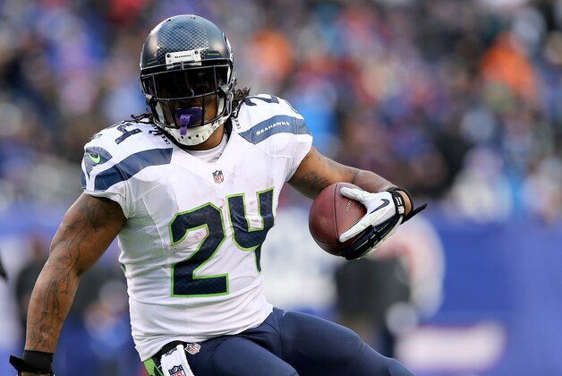 EAST RUTHERFORD, NJ - DECEMBER 15: Marshawn Lynch #24 of the Seattle Seahawks carries the ball in the third quarter against the New York Giants at MetLife Stadium on December 15, 2013 in East Rutherford, New Jersey.The Seattle Seahawks defeated the New York Giants 23-0.  (Photo by Elsa/Getty Images)