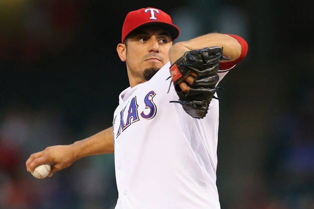 ARLINGTON, TX - SEPTEMBER 26: Matt Garza #22 of the Texas Rangers throws against the Los Angeles Angels in the first inning at Rangers Ballpark in Arlington on September 26, 2013 in Arlington, Texas. (Photo by Ronald Martinez/Getty Images) ARLINGTON, TX - SEPTEMBER 26: Matt Garza #22 of the Texas Rangers throws against the Los Angeles Angels in the first inning at Rangers Ballpark in Arlington on September 26, 2013 in Arlington, Texas. (Photo by Ronald Martinez/Getty Images)