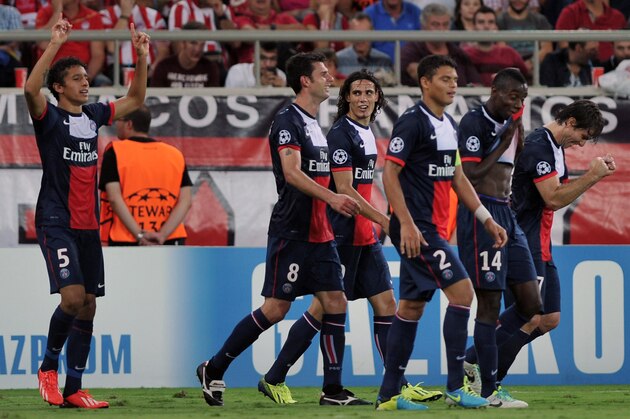 ATHENS, GREECE - SEPTEMBER 17:  Marquinhos (L) of Paris Saint-Germain FC celebrates his goal with team-mates during the UEFA Champions League group stage match between Olympiacos FC and Paris Saint-Germain FC held on September 17, 2013 at the Georgios Karaiskakis Stadium in Athens, Greece. (Photo by Milos Bicanski/EuroFootball/Getty Images)
