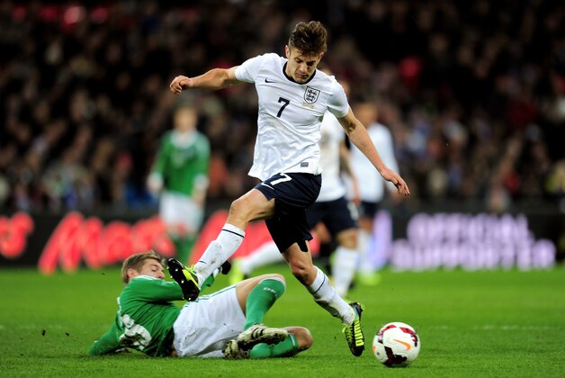 LONDON, ENGLAND - NOVEMBER 19:  Adam Lallana of England is tackled by Toni Kroos of Germany  during the international friendly match between England and Germany at Wembley Stadium on November 19, 2013 in London, England.  (Photo by Shaun Botterill/Getty Images)