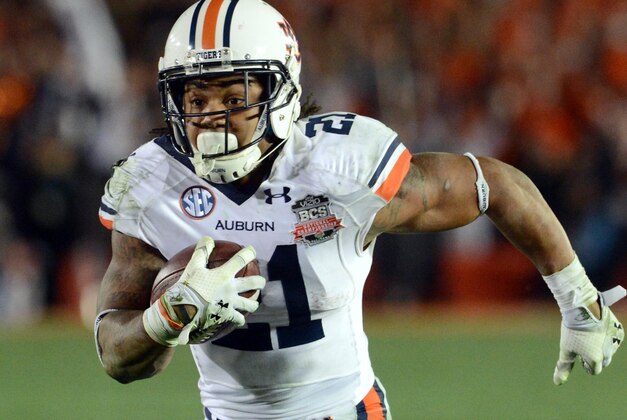 Jan 6, 2014; Pasadena, CA, USA; Auburn Tigers running back Tre Mason (21) scores a touchdown against the Florida State Seminoles during the second half of the 2014 BCS National Championship game at the Rose Bowl.  Mandatory Credit: Jayne Kamin-Oncea-USA TODAY Sports
