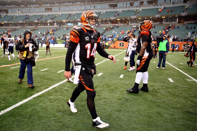 CINCINNATI, OH - JANUARY 05: Quarterback Andy Dalton #14 of the Cincinnati Bengals walks off the field after losing to the San Diego Chargers 27-10 in a Wild Card Playoff game at Paul Brown Stadium on January 5, 2014 in Cincinnati, Ohio. (Photo by Andy Lyons/Getty Images) CINCINNATI, OH - JANUARY 05: Quarterback Andy Dalton #14 of the Cincinnati Bengals walks off the field after losing to the San Diego Chargers 27-10 in a Wild Card Playoff game at Paul Brown Stadium on January 5, 2014 in Cincinnati, Ohio. (Photo by Andy Lyons/Getty Images)