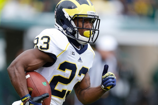 EAST LANSING, MI - NOVEMBER 02: Dennis Norfleet #23 of the Michigan Wolverines heads up field against the Michigan State Spartans at Spartan Stadium on November 2, 2013 in East Lansing, Michigan. (Photo by Gregory Shamus/Getty Images)