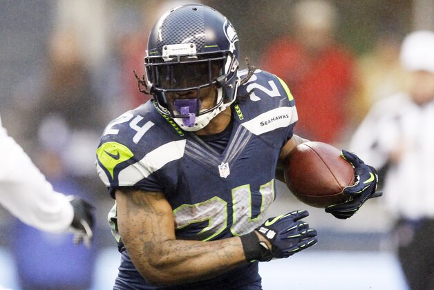 Dec 22, 2013; Seattle, WA, USA; Seattle Seahawks running back Marshawn Lynch (24) rushes against the Arizona Cardinals during the third quarter at CenturyLink Field. Mandatory Credit: Joe Nicholson-USA TODAY Sports Dec 22, 2013; Seattle, WA, USA; Seattle Seahawks running back Marshawn Lynch (24) rushes against the Arizona Cardinals during the third quarter at CenturyLink Field. Mandatory Credit: Joe Nicholson-USA TODAY Sports