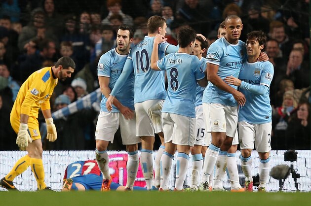 MANCHESTER, ENGLAND - DECEMBER 28: Edin Dzeko of Manchester City is congratulated by his team-mates after scoring the opening goal during the Barclays Premier League match between Manchester City and Crystal Palace at the Etihad Stadium on December 28, 2013 in Manchester, England. (Photo by Jan Kruger/Getty Images) MANCHESTER, ENGLAND - DECEMBER 28: Edin Dzeko of Manchester City is congratulated by his team-mates after scoring the opening goal during the Barclays Premier League match between Manchester City and Crystal Palace at the Etihad Stadium on December 28, 2013 in Manchester, England. (Photo by Jan Kruger/Getty Images)