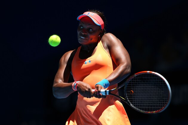 PERTH, AUSTRALIA - DECEMBER 30:  Sloane Stephens of the United States plays a backhand to Anabel Medina Garrigues of Spain in the women's singles match during day three of the Hopman Cup at Perth Arena on December 30, 2013 in Perth, Australia.  (Photo by Paul Kane/Getty Images)