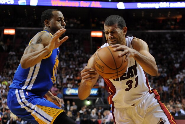 Jan 2, 2014; Miami, FL, USA; Miami Heat small forward Shane Battier (31) is pressured by Golden State Warriors small forward Andre Iguodala (9) during the second half at American Airlines Arena. Mandatory Credit: Steve Mitchell-USA TODAY Sports