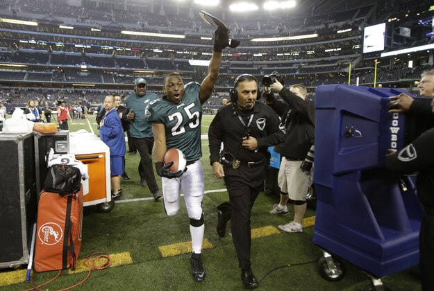 Dec 29, 2013; Arlington, TX, USA; Philadelphia Eagles running back LeSean McCoy (25) celebrates while he leaves the field after the game against the Dallas Cowboys at AT&T Stadium. The Eagle beat the Cowboys 24-22. Mandatory Credit: Tim Heitman-USA TODAY Sports
