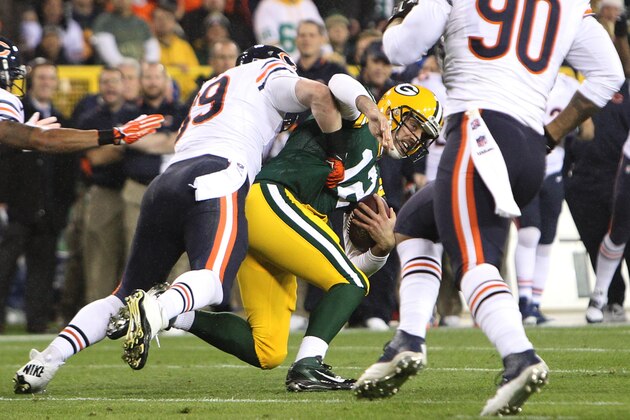 GREEN BAY, WI - NOVEMBER 04: Shea McClellin #99 of the Chicago Bears tackles Aaron Rodgers #12 of the Green Bay Packers during the first quarter at Lambeau Field on November 04, 2013 in Green Bay, Wisconsin. (Photo by Mike McGinnis/Getty Images)