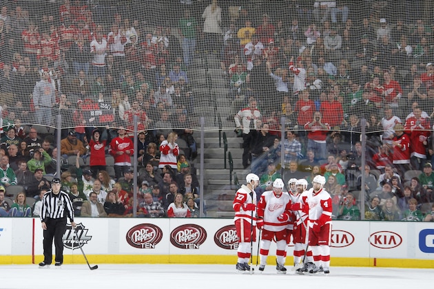 DALLAS, TX - JANUARY 4: Jakub Kindl #4, Kyle Quincey #27 and the Detroit Red Wings celebrate a win against the Dallas Stars at the American Airlines Center on January 4, 2014 in Dallas, Texas. (Photo by Glenn James/NHLI via Getty Images)