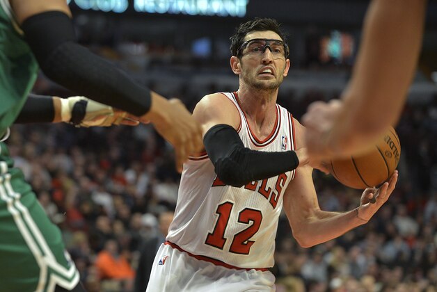 Jan 2, 2014; Chicago, IL, USA; Chicago Bulls shooting guard Kirk Hinrich (12) passes against the Boston Celtics during the 2nd half at the United Center. The Bulls won 94-82. Mandatory Credit: Matt Marton-USA TODAY Sports