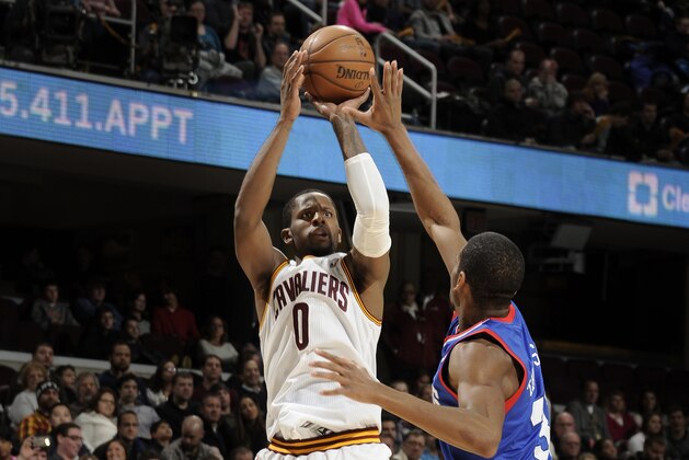 CLEVELAND, OH - JANUARY 7:  C.J. Miles #0 of the Cleveland Cavaliers hits his ninth three pointer to set the franchise single game record against Hollis Thompson #31 of the Philadelphia 76ers at The Quicken Loans Arena on January 7, 2014 in Cleveland, Ohio. NOTE TO USER: User expressly acknowledges and agrees that, by downloading and/or using this Photograph, user is consenting to the terms and conditions of the Getty Images License Agreement. Mandatory Copyright Notice: Copyright 2014 NBAE (Photo by David Liam Kyle/NBAE via Getty Images)
