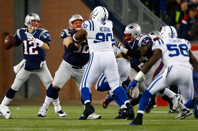 FOXBORO, MA - NOVEMBER 18:  Tom Brady #12 of the New England Patriots throws a pass against the Indianapolis Colts during the game on November 18, 2012 at Gillette Stadium in Foxboro, Massachusetts.  (Photo by Jared Wickerham/Getty Images)