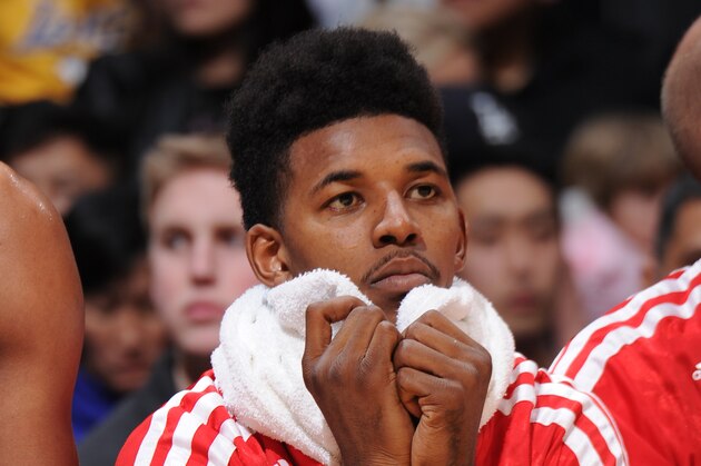 LOS ANGELES, CA - JANUARY 5: Nick Young #0 of the Los Angeles Lakers looks on from the bench during a game against the Denver Nuggets at STAPLES Center on January 5, 2014 in Los Angeles, California. NOTE TO USER: User expressly acknowledges and agrees that, by downloading and/or using this Photograph, user is consenting to the terms and conditions of the Getty Images License Agreement. Mandatory Copyright Notice: Copyright 2014 NBAE (Photo by Andrew D. Bernstein/NBAE via Getty Images)