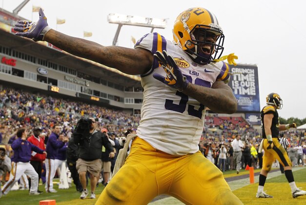 Jan 1, 2014; Tampa, Fl, USA; LSU Tigers running back Jeremy Hill (33) reacts and celebrates after he scored a touchdown against the Iowa Hawkeyes during the second half at Raymond James Stadium. LSU Tigers defeated the Iowa Hawkeyes 21-14. Mandatory Credit: Kim Klement-USA TODAY Sports