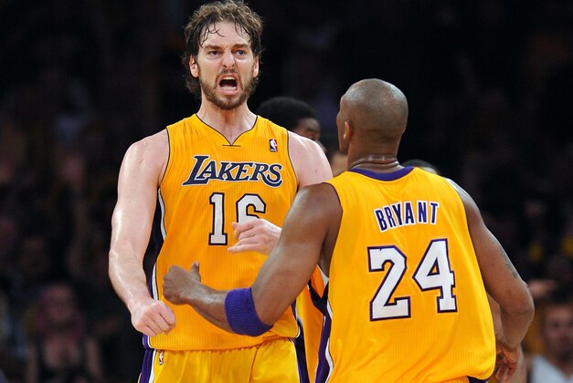 May 12, 2012; Los Angeles, CA, USA;   Los Angeles Lakers power forward Pau Gasol (16) celebrates with teammate Kobe Bryant (24) after making a shot as time expires in the second quarter of game seven of the Western Conference quarterfinals of the 2012 NBA Playoffs against the Denver Nuggets at the Staples Center.  Mandatory Credit: Jayne Kamin-Oncea-USA TODAY Sports
