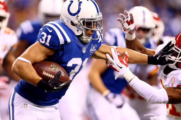 INDIANAPOLIS, IN - JANUARY 04:  Running back Donald Brown #31 of the Indianapolis Colts carries the ball against the Kansas City Chiefs during a Wild Card Playoff game at Lucas Oil Stadium on January 4, 2014 in Indianapolis, Indiana.  (Photo by Andy Lyons/Getty Images)