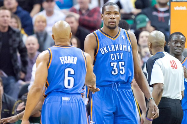 Jan 7, 2014; Salt Lake City, UT, USA; Oklahoma City Thunder point guard Derek Fisher (6) and small forward Kevin Durant (35) react during the second half against the Utah Jazz at EnergySolutions Arena. The Jazz won 112-101. Mandatory Credit: Russ Isabella-USA TODAY Sports