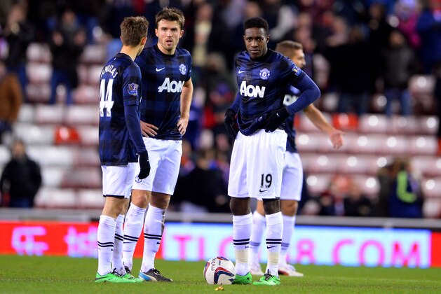 SUNDERLAND, ENGLAND - JANUARY 07:  (L-R) Adnan Januzaj, Michael Carrick and Danny Welbeck of Manchester United look dejected after Fabio Borini of Sunderland scores their second goal during the Capital One Cup Semi-Final, first leg match between Sunderland and Manchester United at Stadium of Light on January 7, 2014 in Sunderland, England.  (Photo by Michael Regan/Getty Images)