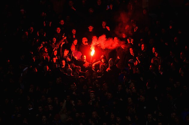 STOKE ON TRENT, ENGLAND - DECEMBER 18:  Manchester United  fans let off a flare during the Capital One Cup Quarter Final match between Stoke City and Manchester United at the Britannia Stadium on December 18, 2013 in Stoke on Trent, England.  (Photo by Michael Regan/Getty Images)