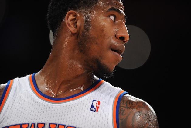 NEW YORK, NY - DECEMBER 16:  Iman Shumpert #21 of the New York Knicks looks on during the fourth quarter against the Washington Wizards at Madison Square Garden on December 16, 2013 in New York City. NOTE TO USER: User expressly acknowledges and agrees that, by downloading and/or using this photograph, user is consenting to the terms and conditions of the Getty Images License Agreement. The Wizards defeat the Knicks 102-101.  (Photo by Maddie Meyer/Getty Images)