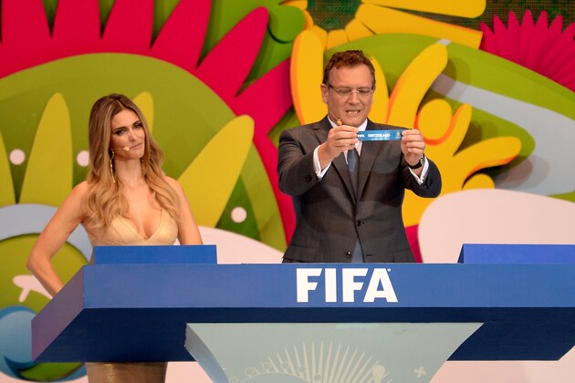 COSTA DO SAUIPE, BRAZIL - DECEMBER 06:  FIFA Secretary General Jerome Valcke holds up the name of Switzerland during the Final Draw for the 2014 FIFA World Cup Brazil at Costa do Sauipe Resort on December 6, 2013 in Costa do Sauipe, Bahia, Brazil.  (Photo by Buda Mendes/Getty Images)