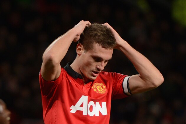 MANCHESTER, ENGLAND - JANUARY 01:  Nemanja Vidic of Manchester United reacts during the Barclays Premier League match between Manchester United and Tottenham Hotspur at Old Trafford on January 1, 2014 in Manchester, England.  (Photo by Michael Regan/Getty Images)
