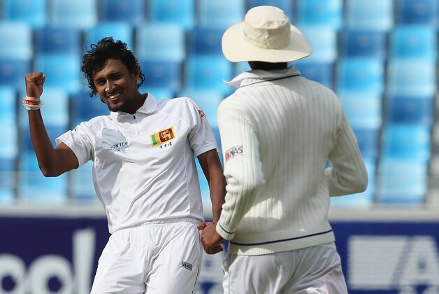 DUBAI, UNITED ARAB EMIRATES - JANUARY 08: Shaminda Eranga of Sri Lanka celebrates after dismissing Asad Shafiq of Pakistan during the first day of the second Test match between Pakistan and Sri Lanka at the Dubai Sports City Cricket Stadium on January 8, 2014 in Dubai, United Arab Emirates. (Photo by Francois Nel/Getty Images) DUBAI, UNITED ARAB EMIRATES - JANUARY 08: Shaminda Eranga of Sri Lanka celebrates after dismissing Asad Shafiq of Pakistan during the first day of the second Test match between Pakistan and Sri Lanka at the Dubai Sports City Cricket Stadium on January 8, 2014 in Dubai, United Arab Emirates. (Photo by Francois Nel/Getty Images)