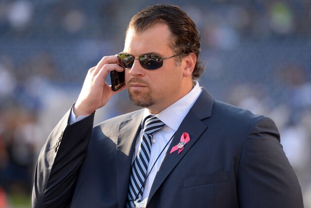 Oct 14, 2013; San Diego, CA, USA; Indianapolis Colts general manager Ryan Grigson talks on a cell phone before the game against the San Diego Chargers at Qualcomm Stadium. Mandatory Credit: Kirby Lee-USA TODAY Sports