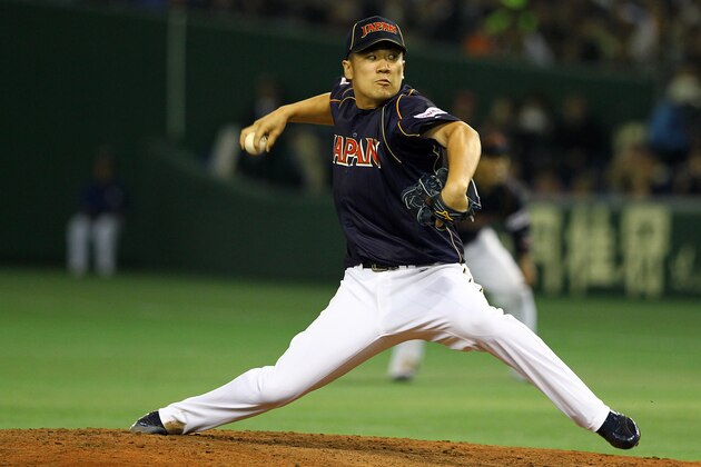 TOKYO, JAPAN - MARCH 08: Pitcher Masahiro Tanaka #17 of Japan pitches during the World Baseball Classic Second Round Pool 1 game between Japan and Chinese Taipei at Tokyo Dome on March 8, 2013 in Tokyo, Japan.  (Photo by Koji Watanabe/Getty Images)