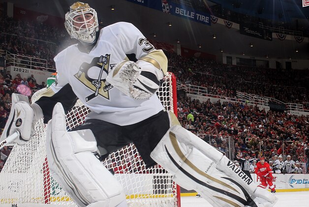 DETROIT, MI - DECEMBER 14: Jeff Zatkoff #37 of the Pittsburgh Penguins comes out of the net to play the puck during an NHL game against the Detroit Red Wings at Joe Louis Arena on December 14, 2013 in Detroit, Michigan. Pittsburgh defeated Detroit 4-1 (Photo by Dave Reginek/NHLI via Getty Images)