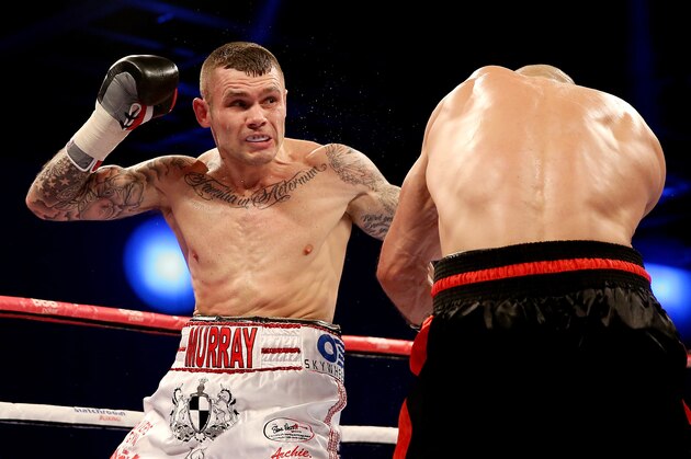 LONDON, ENGLAND - DECEMBER 14:  Martin Murray (L) in actcion with Sergey Khomitsky during their Middleweight bout at ExCel on December 14, 2013 in London, England.  (Photo by Scott Heavey/Getty Images)
