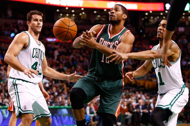 BOSTON, MA - DECEMBER 03: Gary Neal #12 of the Milwaukee Bucks has the ball stripped from him by Courtney Lee #11 of the Boston Celtics in the second half during the game at TD Garden on December 3, 2013 in Boston, Massachusetts. NOTE TO USER: User expressly acknowledges and agrees that, by downloading and or using this photograph, User is consenting to the terms and conditions of the Getty Images License Agreement.  (Photo by Jared Wickerham/Getty Images)