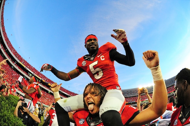 ATHENS, GA - SEPTEMBER 28: Damian Swann #5 and Zach DeBell #76 of the Georgia Bulldogs celebrate after the game against the LSU Tigers at Sanford Stadium on September 28, 2013 in Athens, Georgia. (Photo by Scott Cunningham/Getty Images)