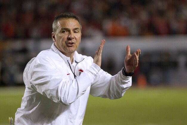 Jan 3, 2014; Miami Gardens, FL, USA; Ohio State Buckeyes head coach Urban Meyer reacts during the first half in the 2014 Orange Bowl college football game against the Clemson Tigers at Sun Life Stadium. Mandatory Credit: Joshua S. Kelly-USA TODAY Sports