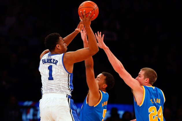 NEW YORK, NY - DECEMBER 19:  Jabari Parker #1 of the Duke Blue Devils puts up a second half shot against Kyle Anderson #5 and Travis Wear #24 of the UCLA Bruins during the CARQUEST Auto Parts Classic on December 19, 2013 at Madison Square Garden in New York City.  (Photo by Jim McIsaac/Getty Images)