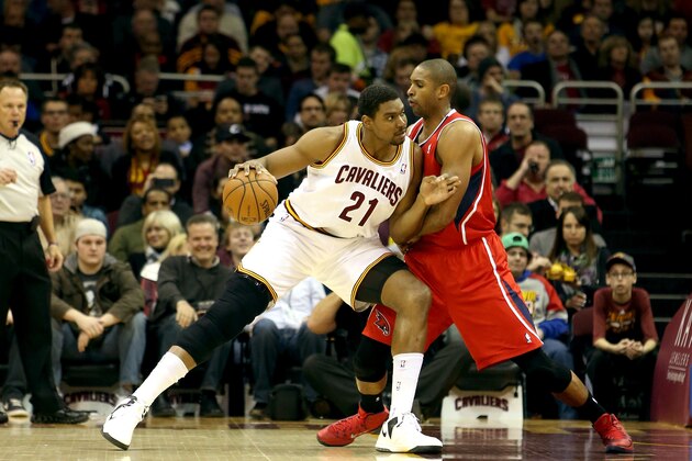 CLEVELAND, OH - DECEMBER 26: Andrew Bynum #21 of the Cleveland Cavaliers handles the ball against Al Horford #15 of the Atlanta Hawks in the first half at Quicken Loans Arena on December 26, 2013 in Cleveland, Ohio.  NOTE TO USER: User expressly acknowledges and agrees that, by downloading and/or using this photograph, user is consenting to the terms and conditions of the Getty Images License Agreement.  (Photo by Mike Lawrie/Getty Images)