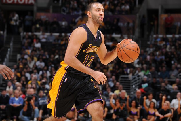 LOS ANGELES, CA - DECEMBER 31: Kendall Marshall #12 of the Los Angeles Lakers handles the basketball during a game against the Milwaukee Bucks at STAPLES Center on December 31, 2013 in Los Angeles, California. NOTE TO USER: User expressly acknowledges and agrees that, by downloading and/or using this Photograph, user is consenting to the terms and conditions of the Getty Images License Agreement. Mandatory Copyright Notice: Copyright 2013 NBAE (Photo by Andrew D. Bernstein/NBAE via Getty Images)