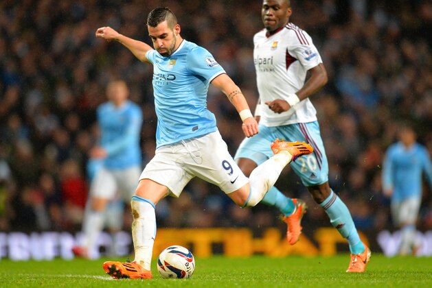 MANCHESTER, ENGLAND - JANUARY 08:  Alvaro Negredo of Manchester City in action during the Capital One Cup Semi-Final first leg match between Manchester City and West Ham United at Etihad Stadium on January 8, 2014 in Manchester, England.  (Photo by Shaun Botterill/Getty Images)