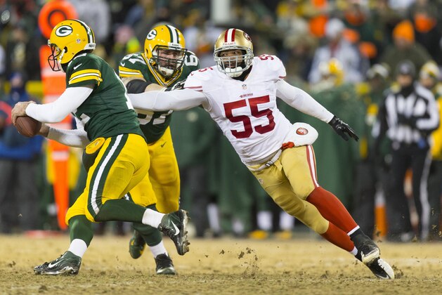 Jan 5, 2014; Green Bay, WI, USA; San Francisco 49ers linebacker Ahmad Brooks (55) chases Green Bay Packers quarterback Aaron Rodgers (12) during the third quarter of the 2013 NFC wild card playoff football game at Lambeau Field. Mandatory Credit: Jeff Hanisch-USA TODAY Sports