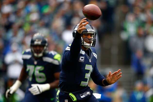 SEATTLE - DECEMBER 29:  Quarterback Russell Wilson #3 of the Seattle Seahawks throws a pass against the St. Louis Rams on December 29, 2013 at CenturyLink Field in Seattle, Washington.  (Photo by Jonathan Ferrey/Getty Images)
