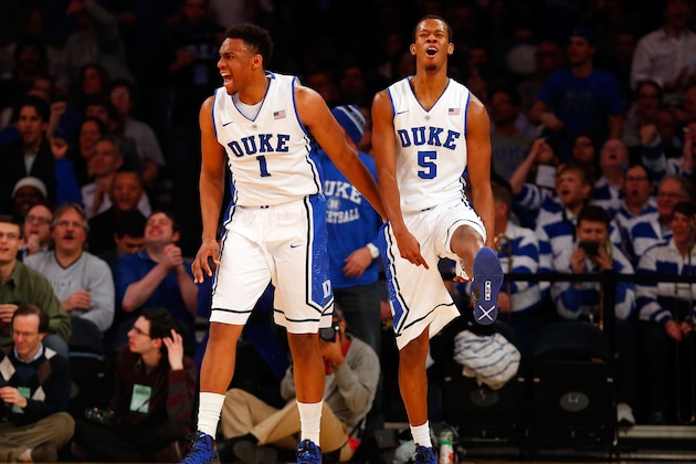 NEW YORK, NY - DECEMBER 19:  Rodney Hood #5 of the Duke Blue Devils reacts with teammate Jabari Parker #1 after his basket was disallowed in the second half against the UCLA Bruins during the CARQUEST Auto Parts Classic on December 19, 2013 at Madison Square Garden in New York City.  (Photo by Jim McIsaac/Getty Images)
