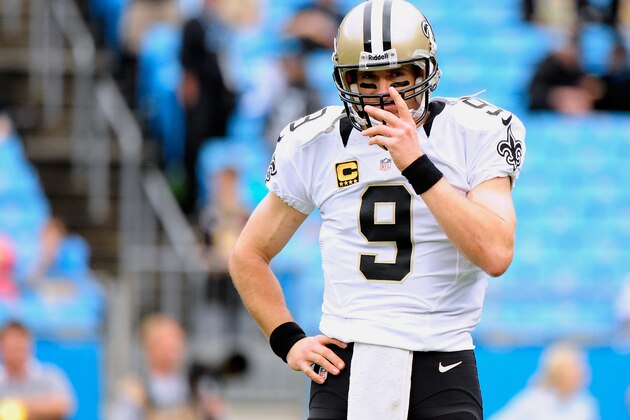 CHARLOTTE, NC - DECEMBER 22:  Drew Brees #9 of the New Orleans Saints warms up before a game against the Carolina Panthers at Bank of America Stadium on December 22, 2013 in Charlotte, North Carolina.  (Photo by Grant Halverson/Getty Images)