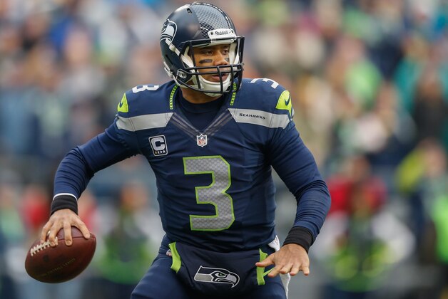 SEATTLE, WA - DECEMBER 29:  Quarterback Russell Wilson #3 of the Seattle Seahawks looks downfield to pass against the St. Louis Rams at CenturyLink Field on December 29, 2013 in Seattle, Washington.  (Photo by Otto Greule Jr/Getty Images)