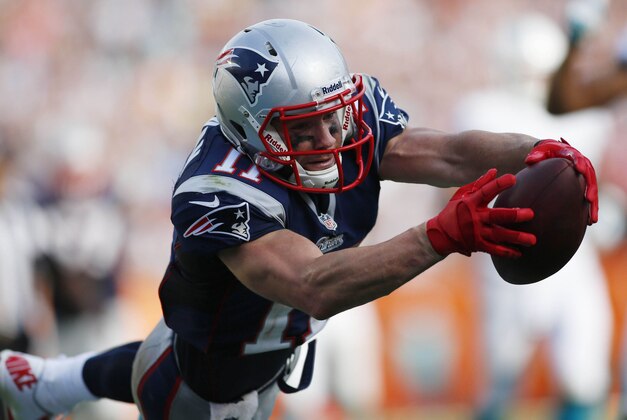 Dec 15, 2013; Miami Gardens, FL, USA: New England Patriots wide receiver Julian Edelman (11) scores a touchdown in the second half against the Miami Dolphins at Sun Life Stadium. The Dolphins won 24-20. Mandatory Credit: Robert Mayer-USA TODAY Sports