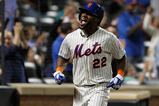 NEW YORK, NY - AUGUST 06:  Eric Young Jr. #22 of the New York Mets celebrates after scoring a go ahead run on a Juan Lagares #12 single in the eighth inning against the Colorado Rockies at Citi Field on August 6, 2013 at Citi Field in the Flushing neighborhood of the Queens borough of New York City. Mets defeated the Rockies 3-2.  (Photo by Mike Stobe/Getty Images)