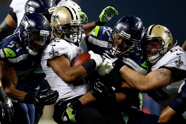 SEATTLE, WA - DECEMBER 02:  Running back Mark Ingram #22 of the New Orleans Saints carries the ball against the Seattle Seahawks during a game at CenturyLink Field on December 2, 2013 in Seattle, Washington.  (Photo by Otto Greule Jr/Getty Images)
