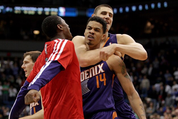 Jan 8, 2014; Minneapolis, MN, USA; Phoenix Suns guard Gerald Green (14) celebrates with center Alex Len (21) during the fourth quarter against the Minnesota Timberwolves at Target Center. The Suns defeated the Timberwolves 104-103. Mandatory Credit: Brace Hemmelgarn-USA TODAY Sports